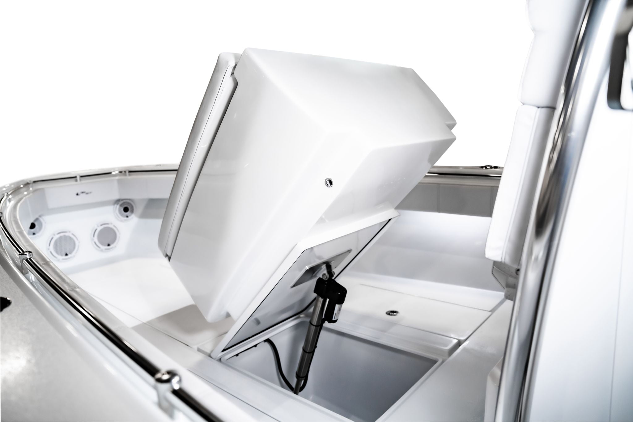A close-up view of a white boat's storage compartment with its lid open, revealing a hydraulic lift mechanism.
