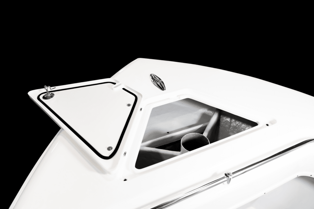 White boat storage compartment with an open hatch and a cylindrical object inside against a black background.
