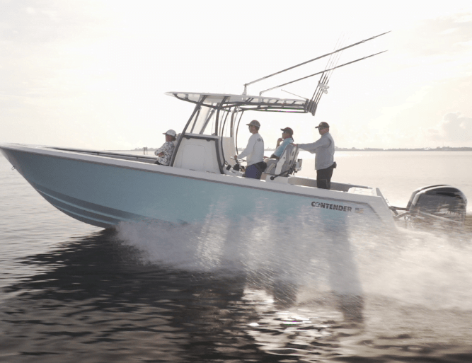 Four people are standing on a light blue fishing boat labeled "CONTIENDER," moving quickly over calm waters with fishing rods visible.