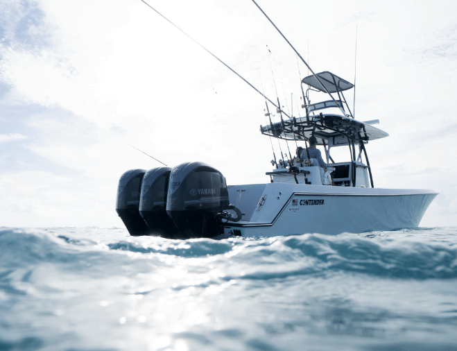 A boat with three Yamaha outboard motors is floating on the water.