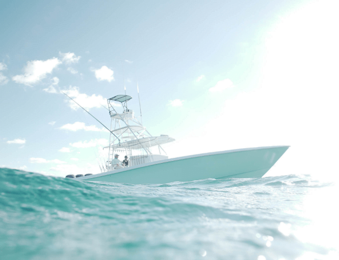 A white boat sails on a calm ocean, with a bright and clear sky in the background.