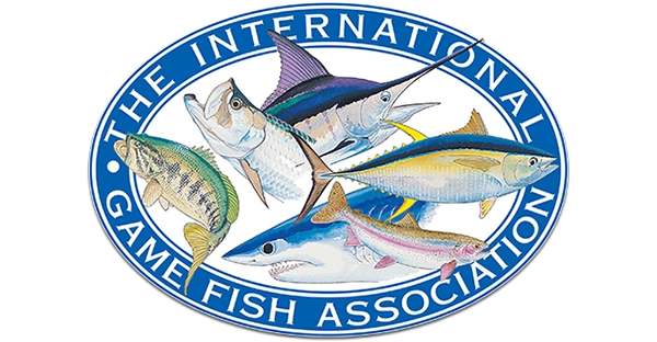 Logo of The International Game Fish Association featuring various fish species including a marlin, tuna, trout, shark, and bass within an oval border.